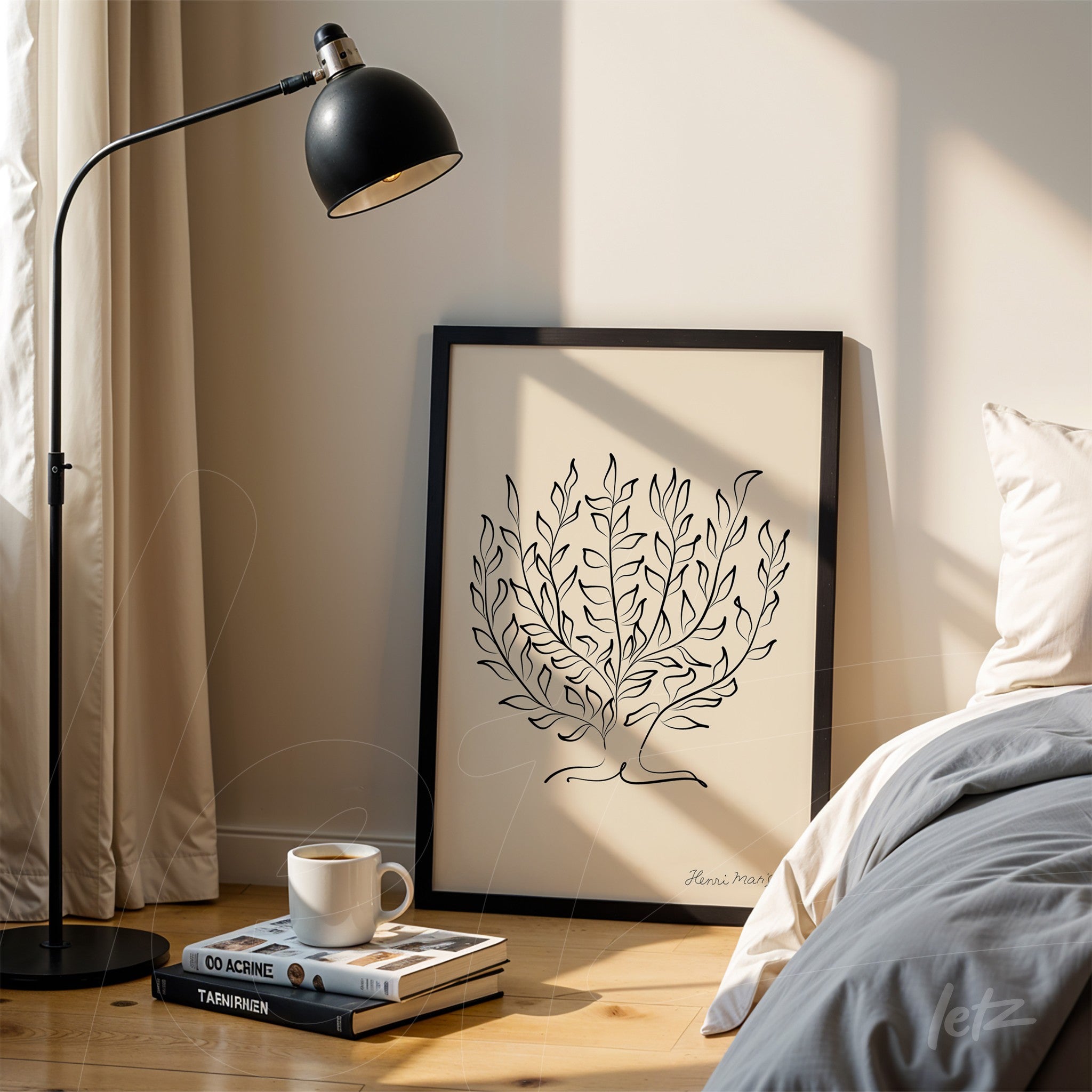 quadro com ilustração minimalista de uma planta em moldura preta apoiado ao lado de uma cama com lençol cinza