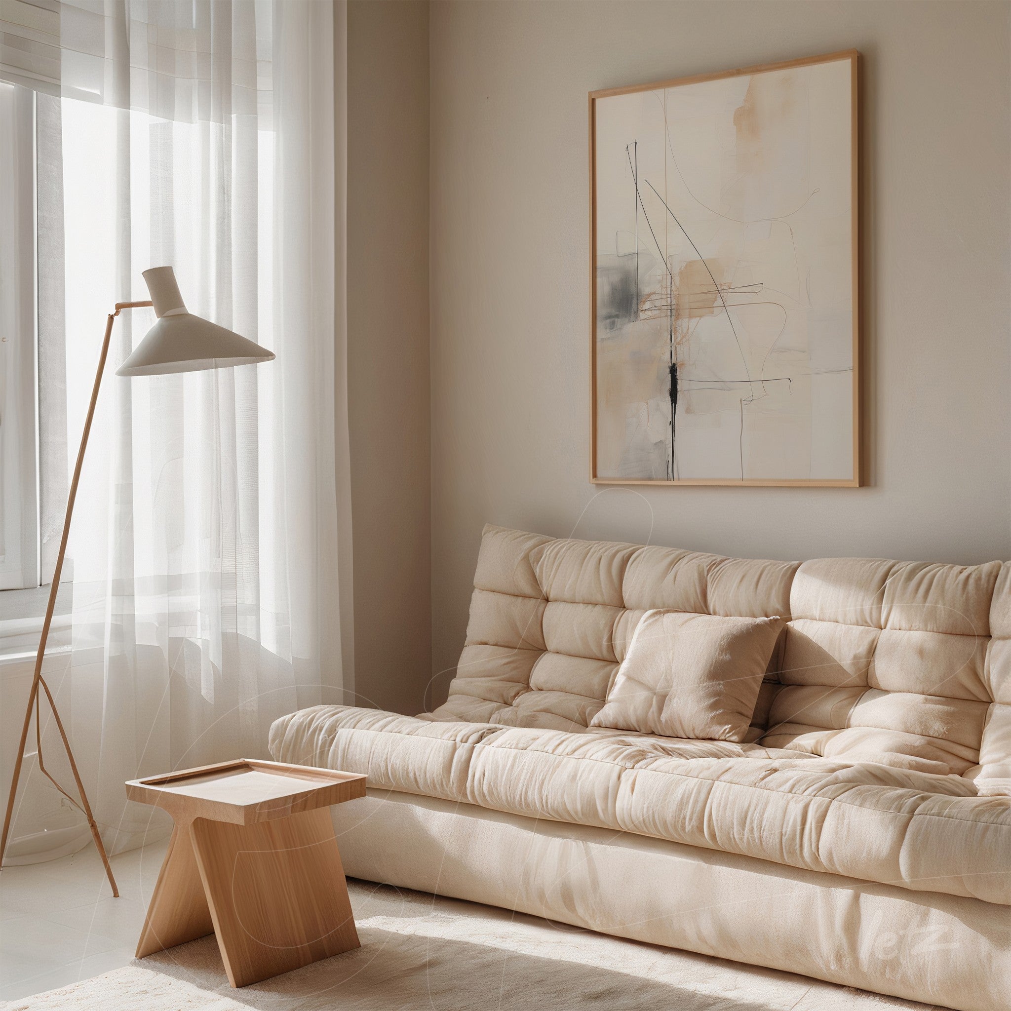 quadro abstrato com traços minimalistas em moldura clara, exibido sobre sofá de tecido neutro em ambiente iluminado