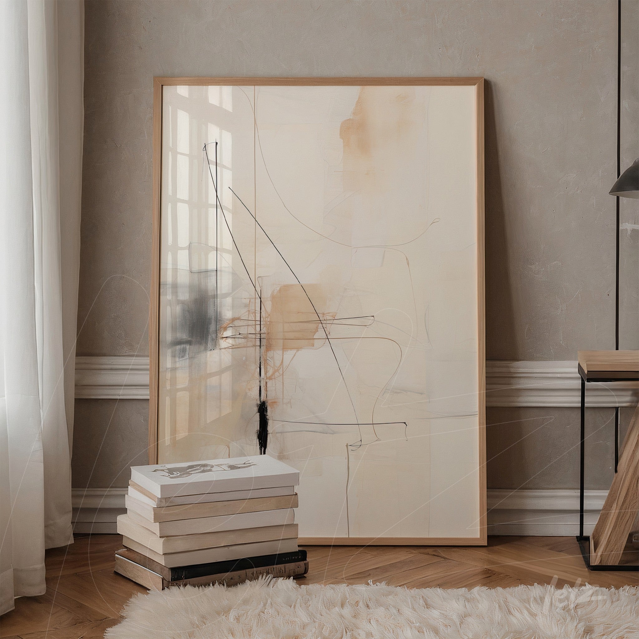 quadro abstrato com linhas em tons de bege e preto em moldura de madeira clara, apoiado em uma parede texturizada