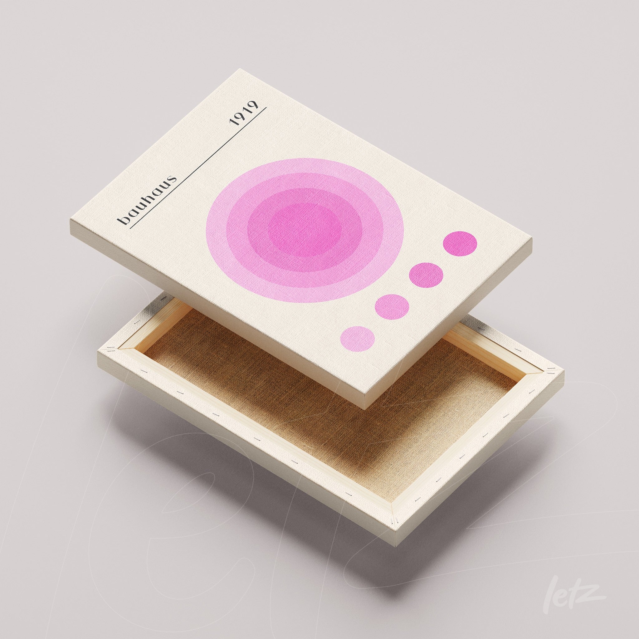 tela em canvas com design minimalista de círculos rosa e lilás sobre fundo claro, acompanhada de moldura de madeira clara