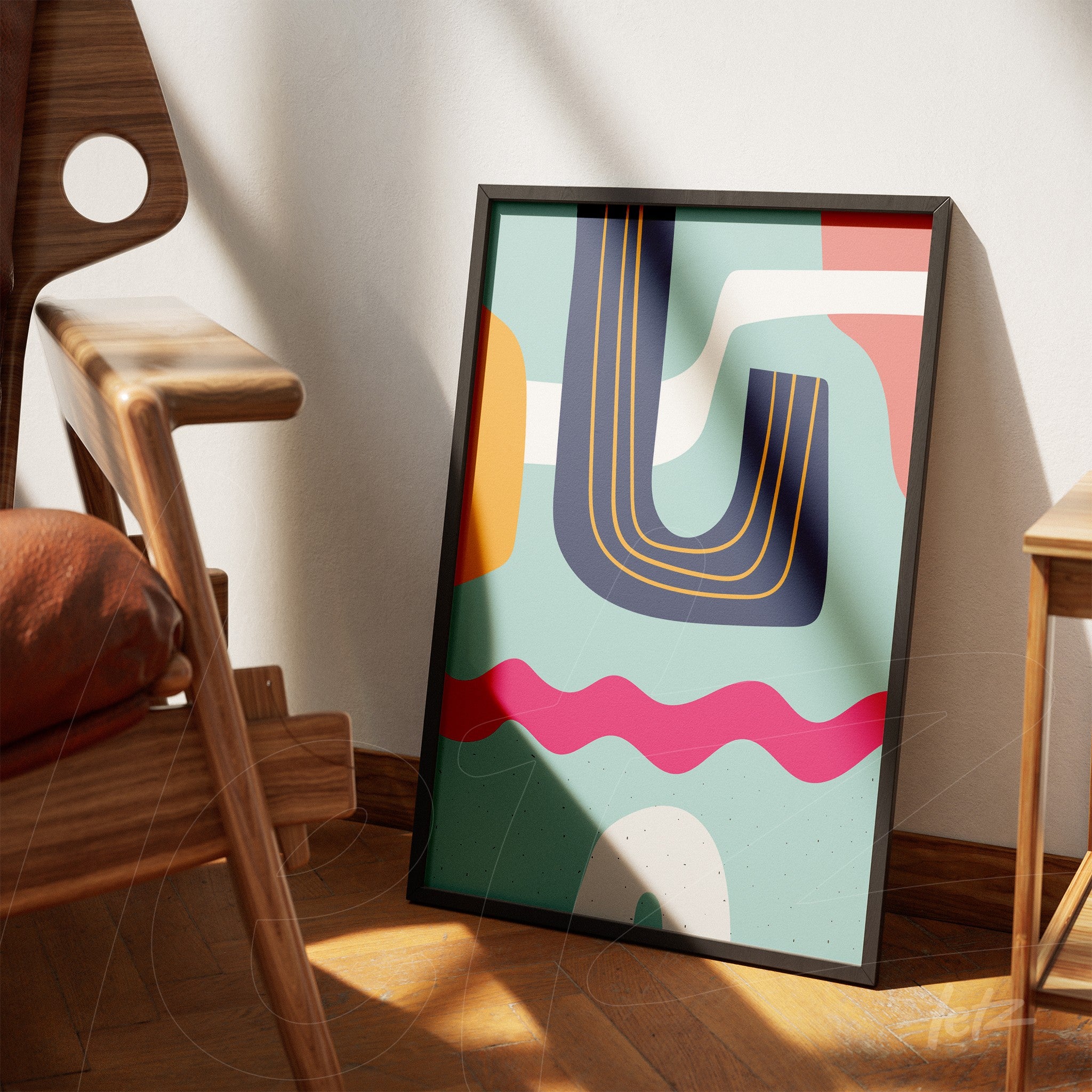 ```json
{
"alt": "quadro com arte abstrata boho em tons vibrantes e moldura preta apoiado em chão de madeira ao lado de cadeira moderna",
"alt_en": "framed boho abstract art in vibrant colors leaning on wooden floor next to a modern chair"
}
```