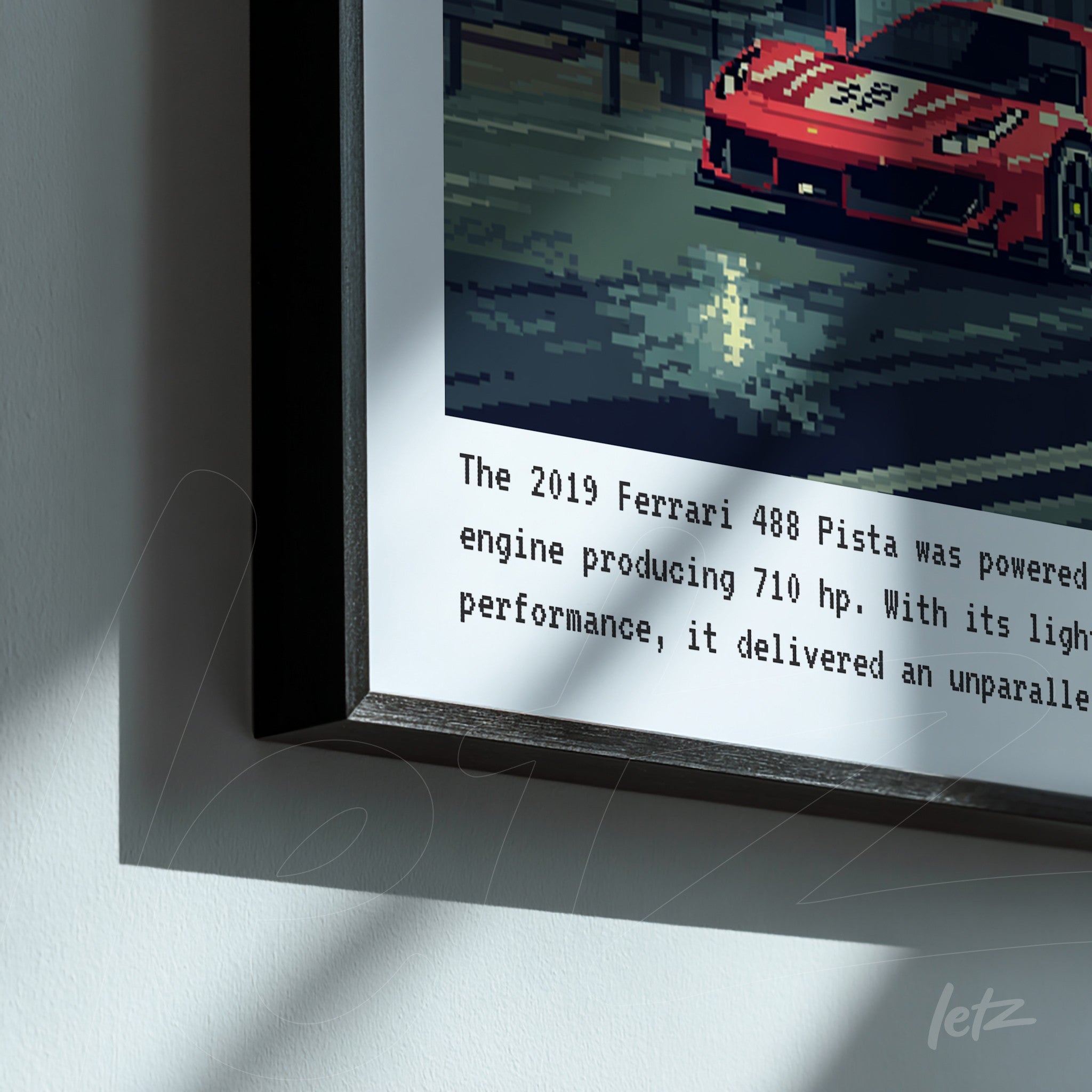 quadro em moldura preta com arte pixelada de um carro esportivo vermelho, destacando elementos de corrida e o texto informativo sobre o Ferrari 488 Pista
