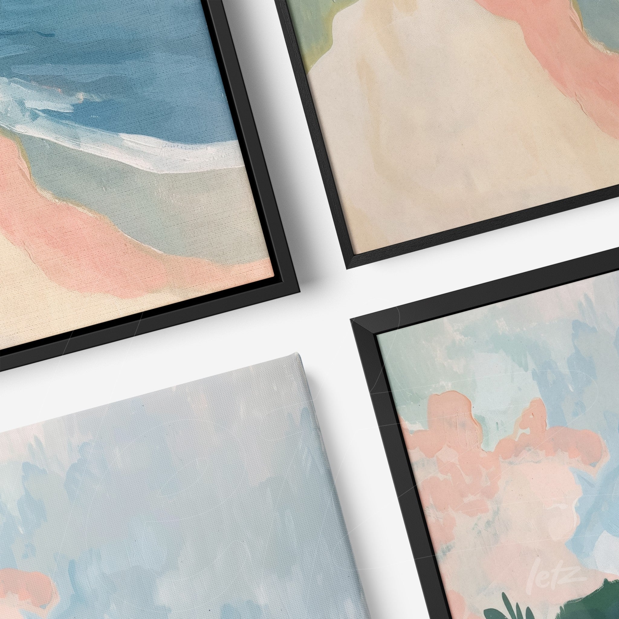 composição com quadros em moldura preta retratando paisagens abstratas em tons pastéis e suaves