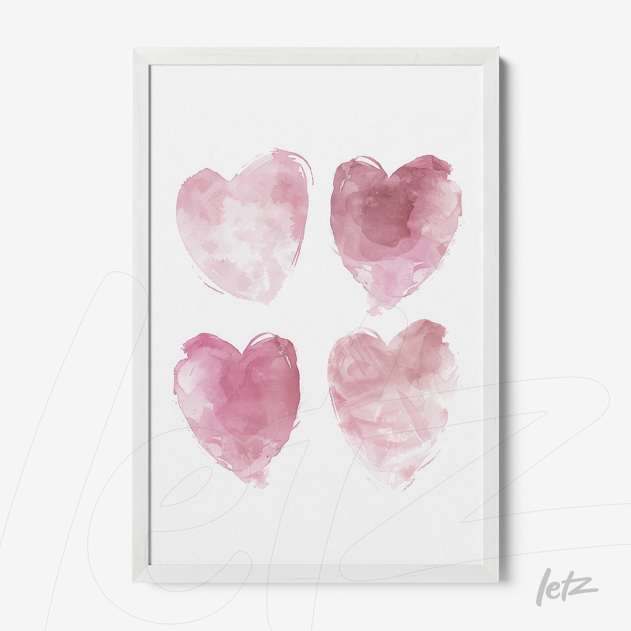 quadro com quatro corações aquarelados em tons de rosa em moldura branca