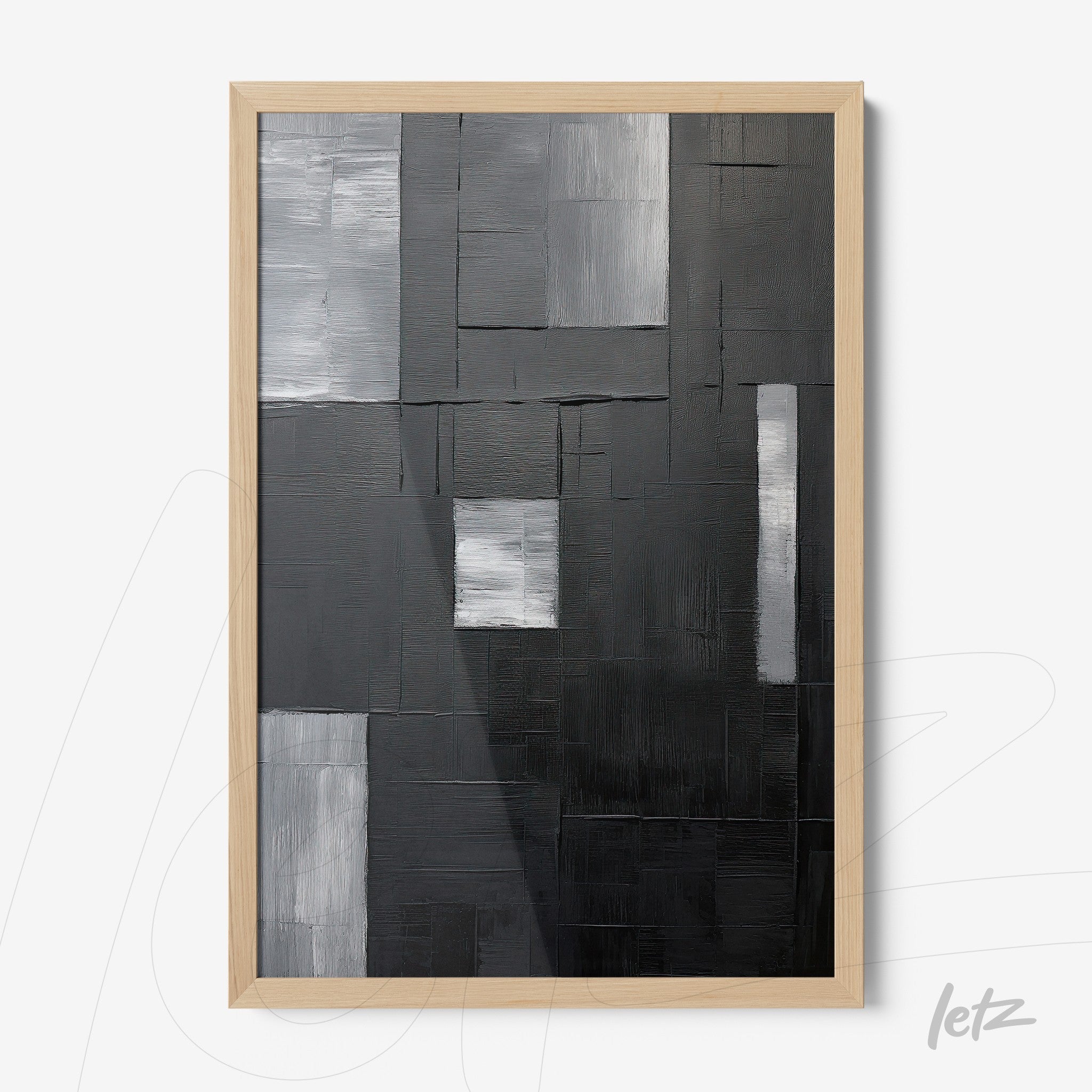 quadro abstrato em tons de preto, cinza e branco, com moldura de madeira clara