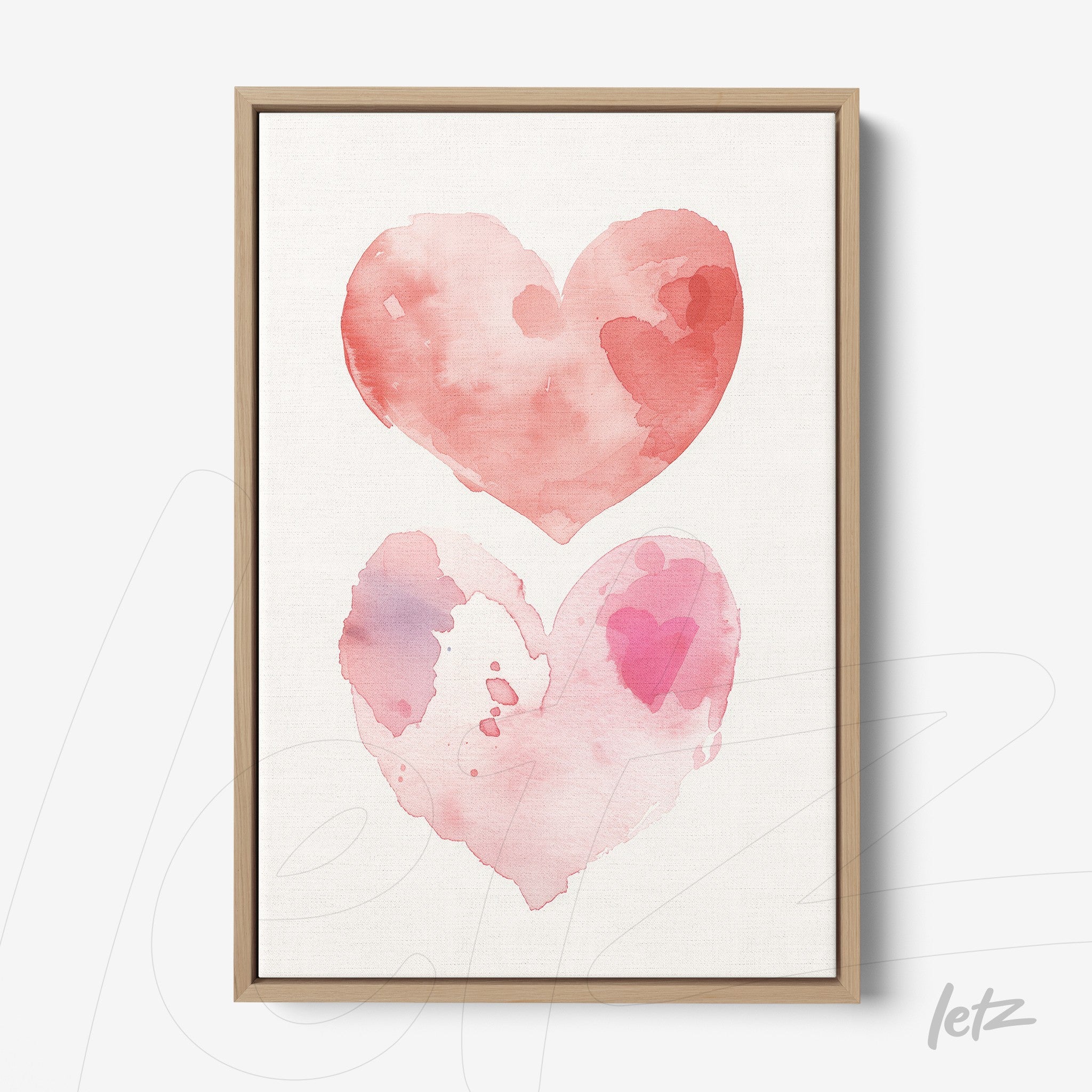 quadro com arte em aquarela de dois corações interligados em tons de rosa, com moldura de madeira clara