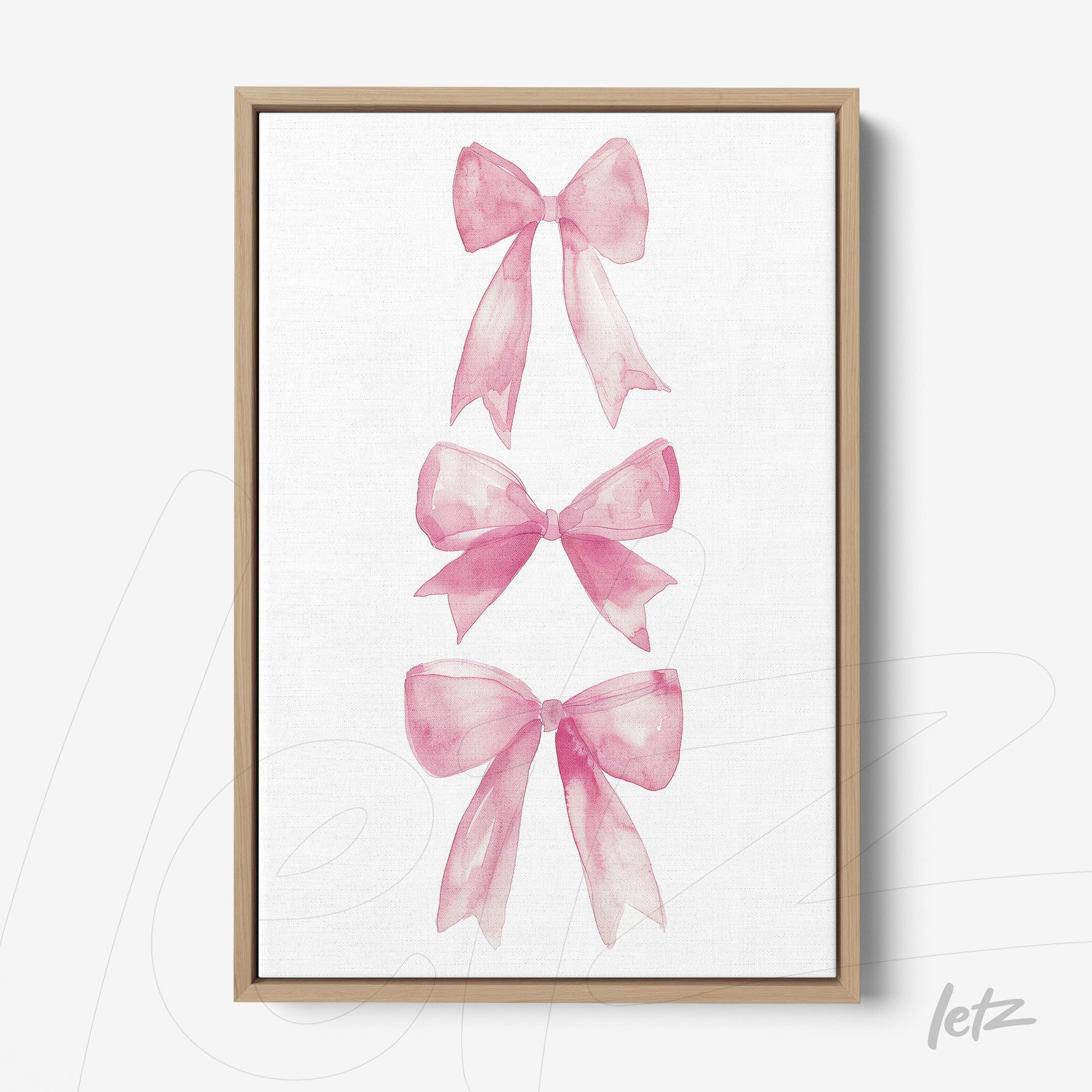 quadro em canvas com ilustrações de laços rosa em fundo branco, moldura de madeira clara