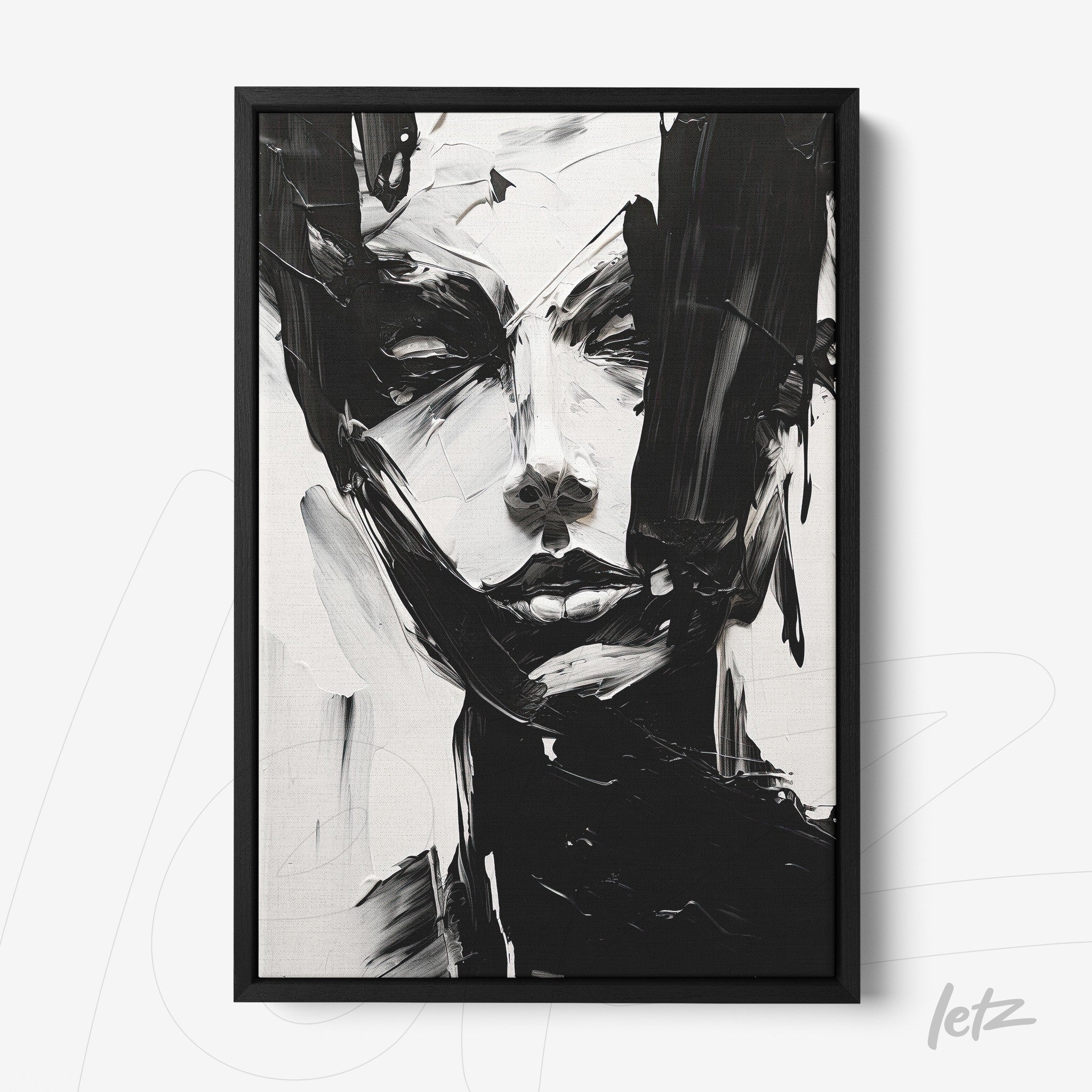 quadro retratando um rosto feminino abstrato em tons de preto e branco com moldura preta