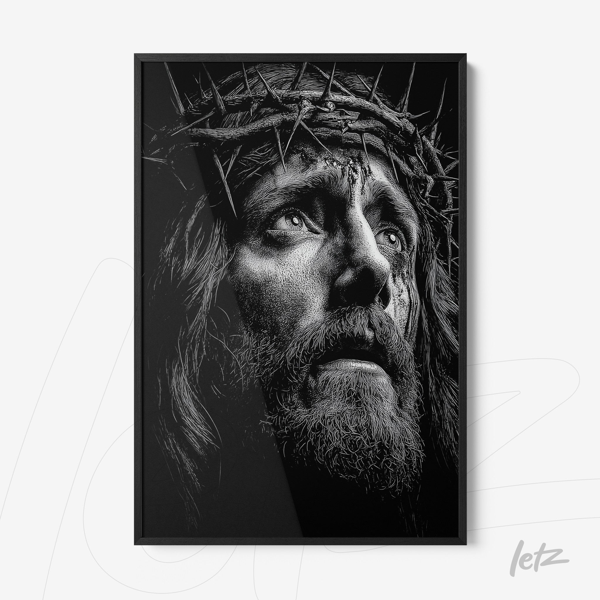 quadro em preto e branco com retrato dramático de Jesus Cristo usando coroa de espinhos em moldura preta