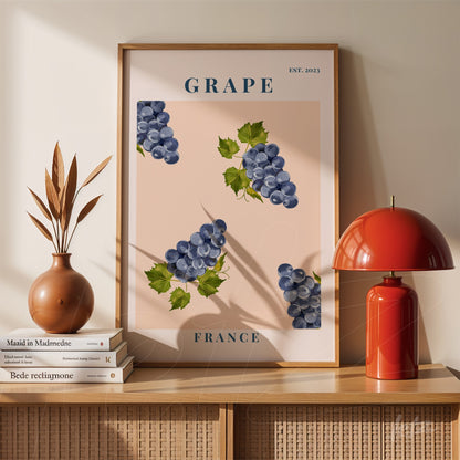quadro com ilustração de uvas azuis em fundo rosa, moldura fina em madeira e texto 'GRAPE' e 'FRANCE'