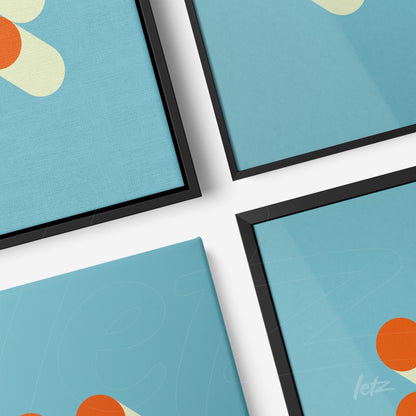 quatro quadros com arte abstrata em nuances de azul e formas geométricas, apresentados com molduras pretas sobre superfície branca