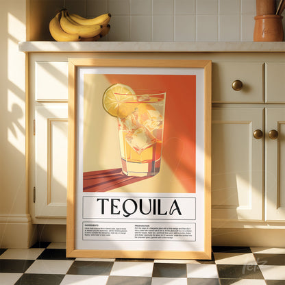 quadro com arte gráfica do drink tequila em moldura de madeira clara, destacado sobre bancada de cozinha com fundo amarelo e laranja