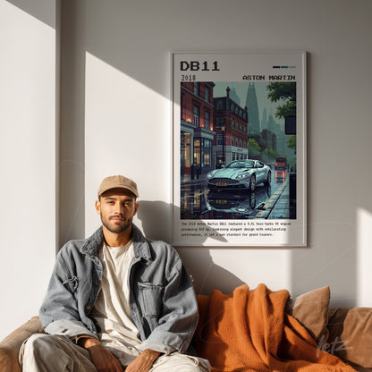 quadro com arte gráfica do carro Aston Martin DB11 com fundo urbano em moldura branca, exibido em ambiente de sala moderna