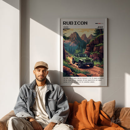 quadro emoldurado com arte retro do Jeep Rubicon em fundo montanhoso, exposto em parede clara com pessoa sentada ao lado