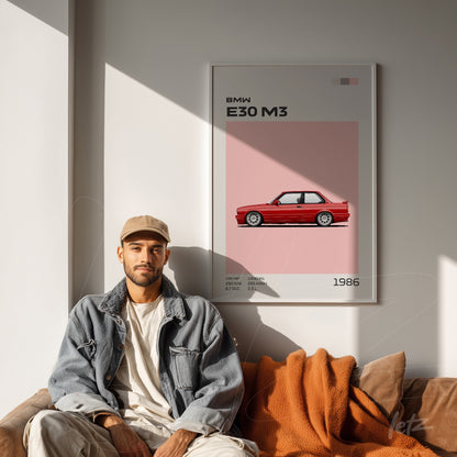 quadro com arte estética do carro BMW E30 M3 em moldura branca, exibido em ambiente moderno com sofá marrom