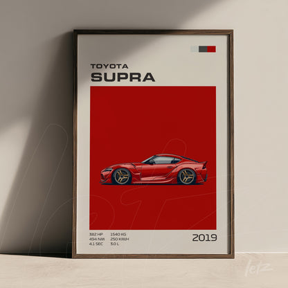 quadro com arte digital do carro Toyota Supra em destaque sobre fundo vermelho vibrante, moldura de madeira escura