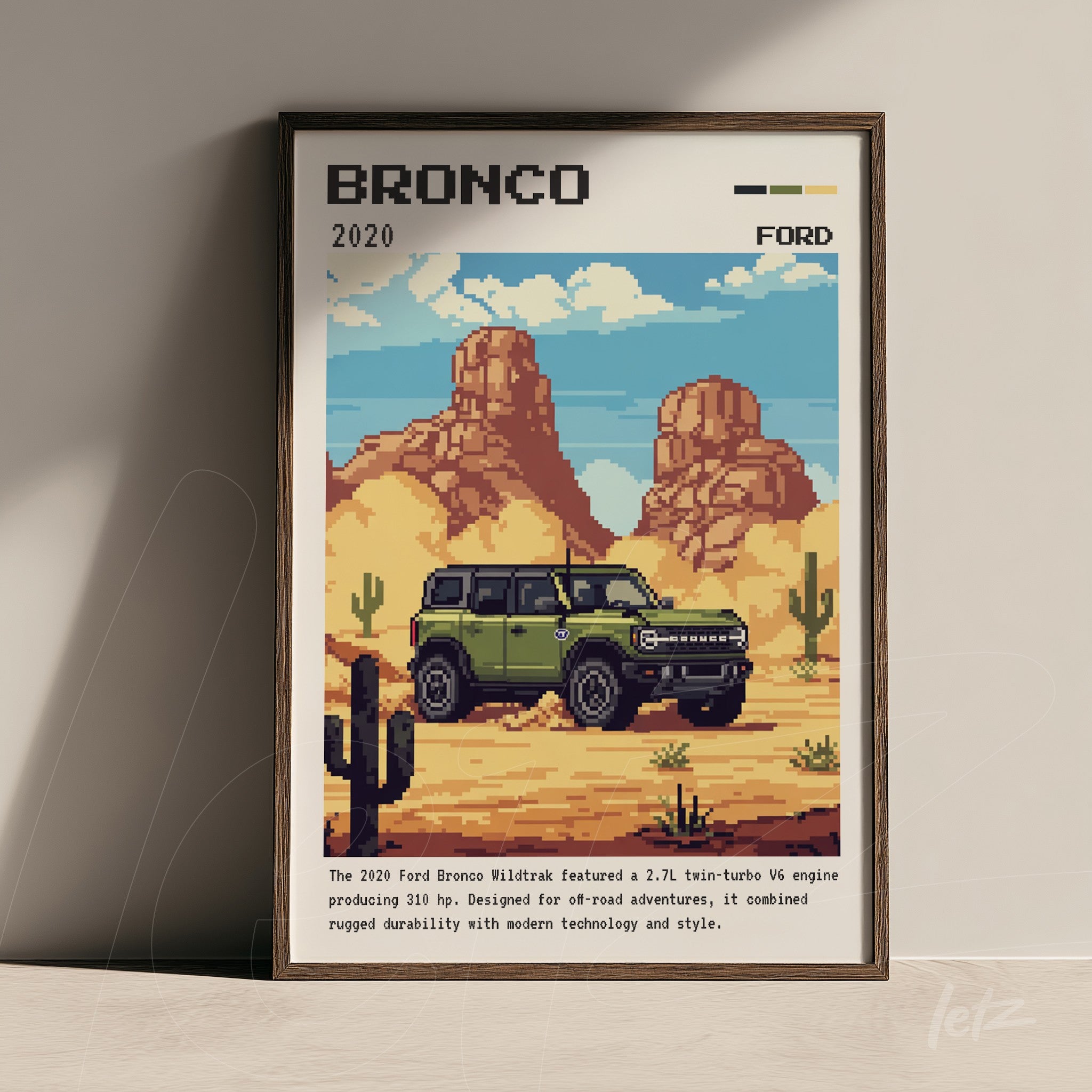 quadro com arte digital em estilo pixelado do Ford Bronco 2020 em uma paisagem desértica com cactos e montanhas ao fundo, moldura de madeira escura