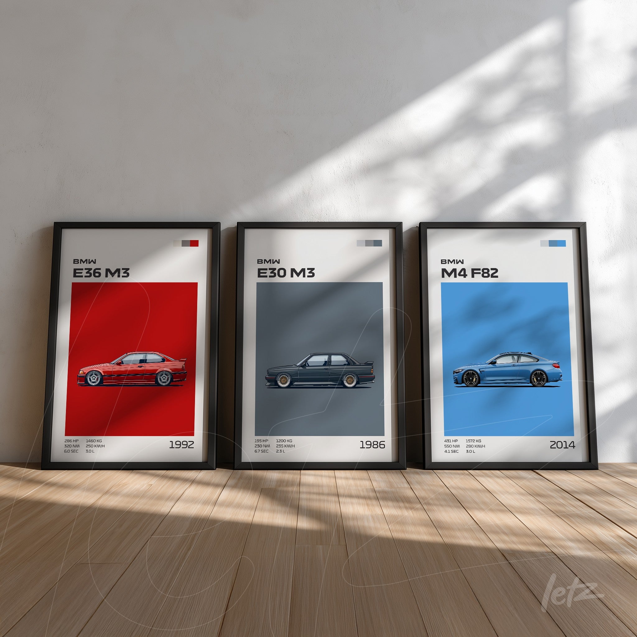 composição com três quadros decorativos de carros BMW em molduras pretas, destacando os modelos E36 M3 de 1992, E30 M3 de 1986 e M4 F82 de 2014 sobre fundo claro