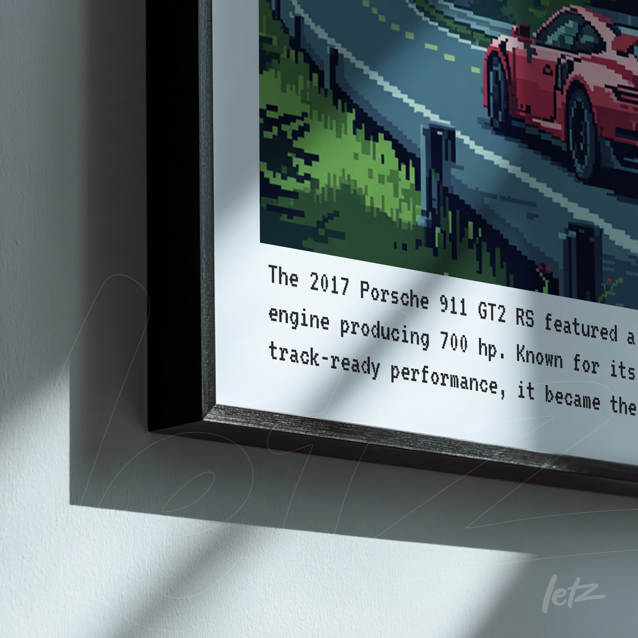 quadro com arte pixelada de um Porsche 911 GT2 RS em uma estrada, moldura preta e texto informativo abaixo da imagem