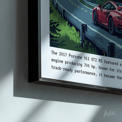 quadro com arte pixelada de um Porsche 911 GT2 RS em uma estrada, moldura preta e texto informativo abaixo da imagem