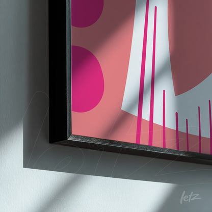 detalhe de quadro boho com formas geométricas em tons de rosa e moldura preta moderna