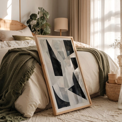 quadro com arte abstrata em moldura de madeira clara em ambiente de quarto aconchegante