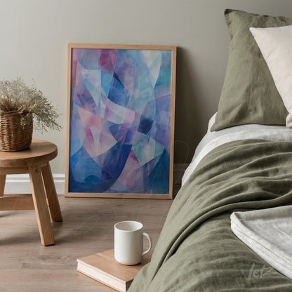 quadro abstrato em moldura clara com tonalidades azuis e rosas apoiado ao lado da cama em quarto moderno