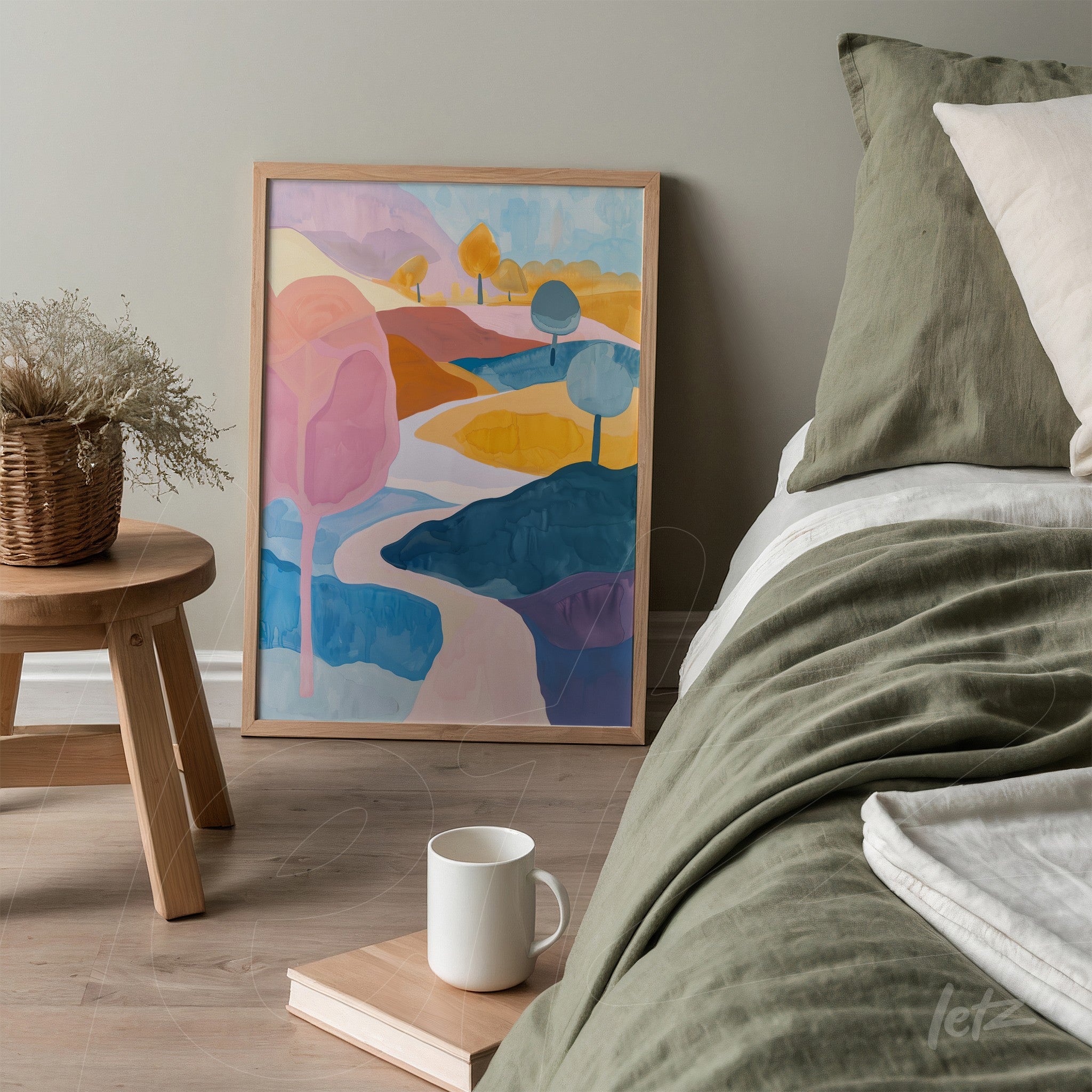 quadro com arte abstrata de paisagem colorida em moldura clara exibido ao lado de uma cama decorada com roupa de cama em tons de verde