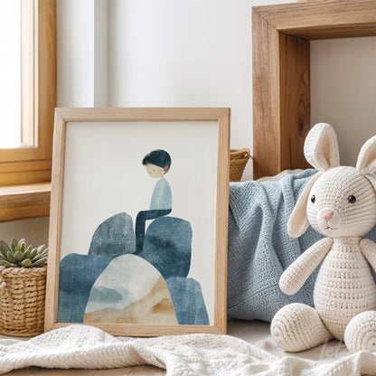 quadro com ilustração de menino sentado em pedras azuladas em moldura de madeira clara