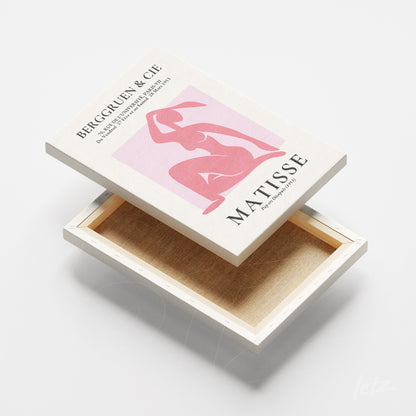 quadro em tela com arte de Matisse, apresentando figura feminina em tons de rosa em fundo claro, moldura de canvas branca