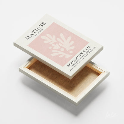 quadro em canvas com arte moderna em fundo rosa claro, moldura branca e textura suave