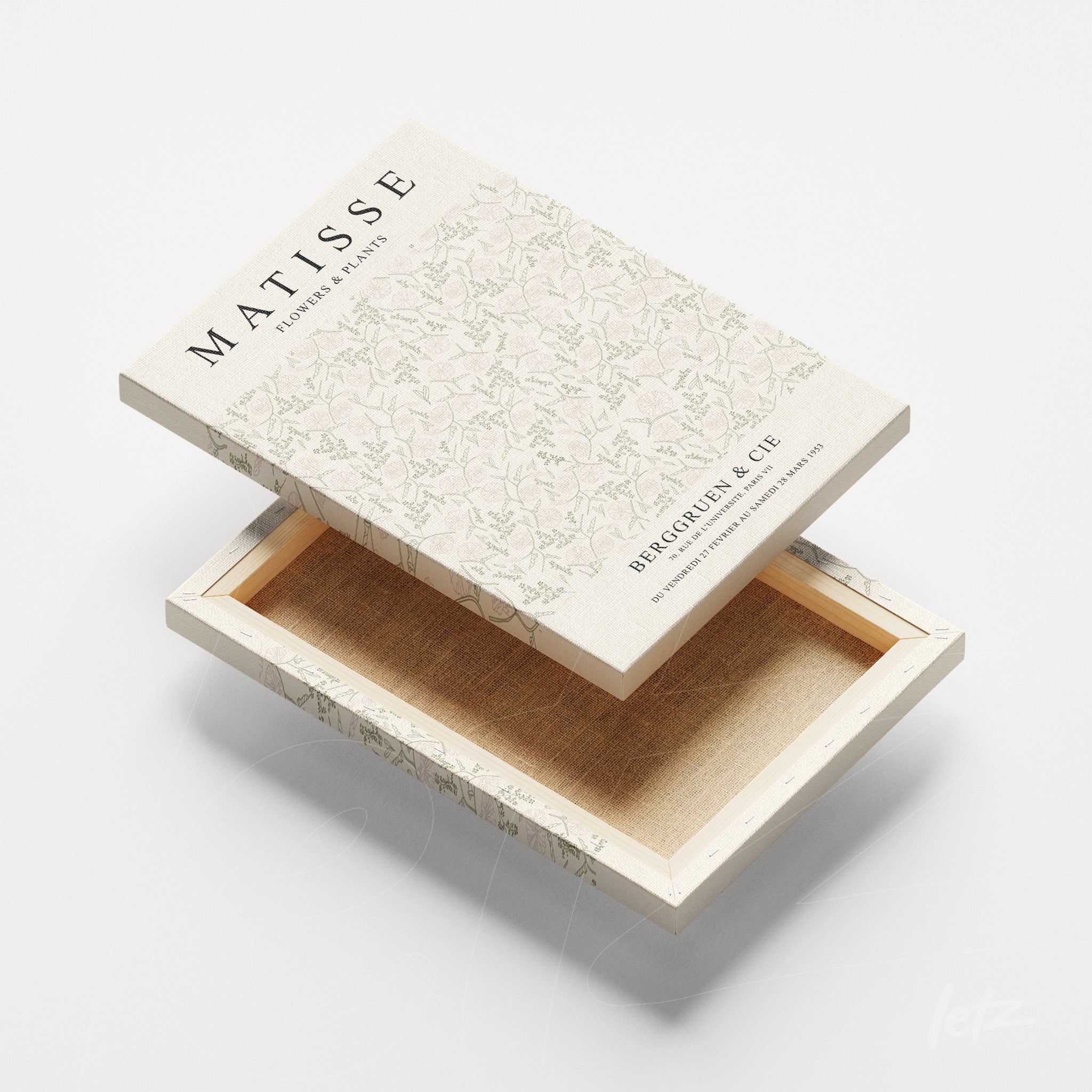 caixa de quadro com design floral leve e detalhe em tonalidades claras, aberta, revelando o interior em tom neutro