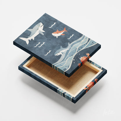 quadro em canvas com ilustração de tubarões e peixes sobre fundo azul marinho