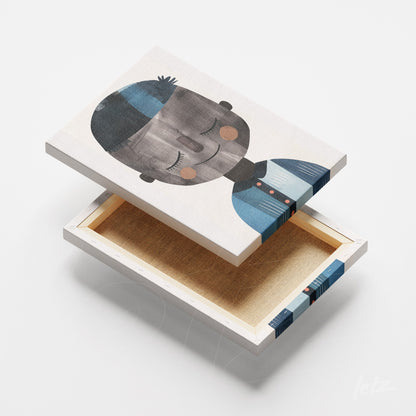 quadro em canvas com ilustração de rosto infantil em tons de azul e cinza, moldura branca