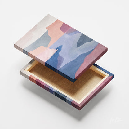 quadro de tela em canvas com design abstrato em cores suaves e moldura em tons variados