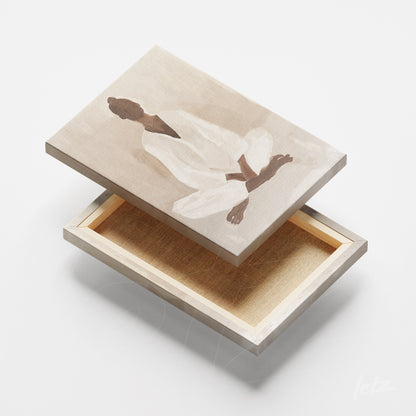 quadro em tela canvas com arte abstrata de figura humana em meditação sobre fundo neutro