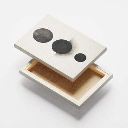 quadro em canvas com arte abstrata em preto e branco de círculos sobre fundo leve