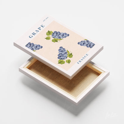 caixa decorativa com ilustração de uvas em fundo claro e texto em azul