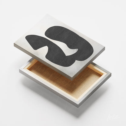 quadro em canvas com arte abstrata em preto sobre fundo prateado