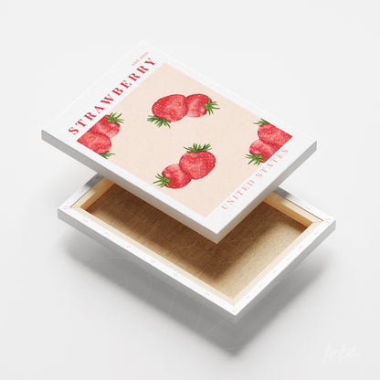 quadro com arte de morangos em fundo rosa e moldura branca com detalhes texturizados