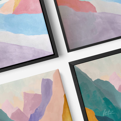 série de quadros com arte abstrata em molduras pretas, apresentando montanhas em tons suaves de azul, rosa e roxo