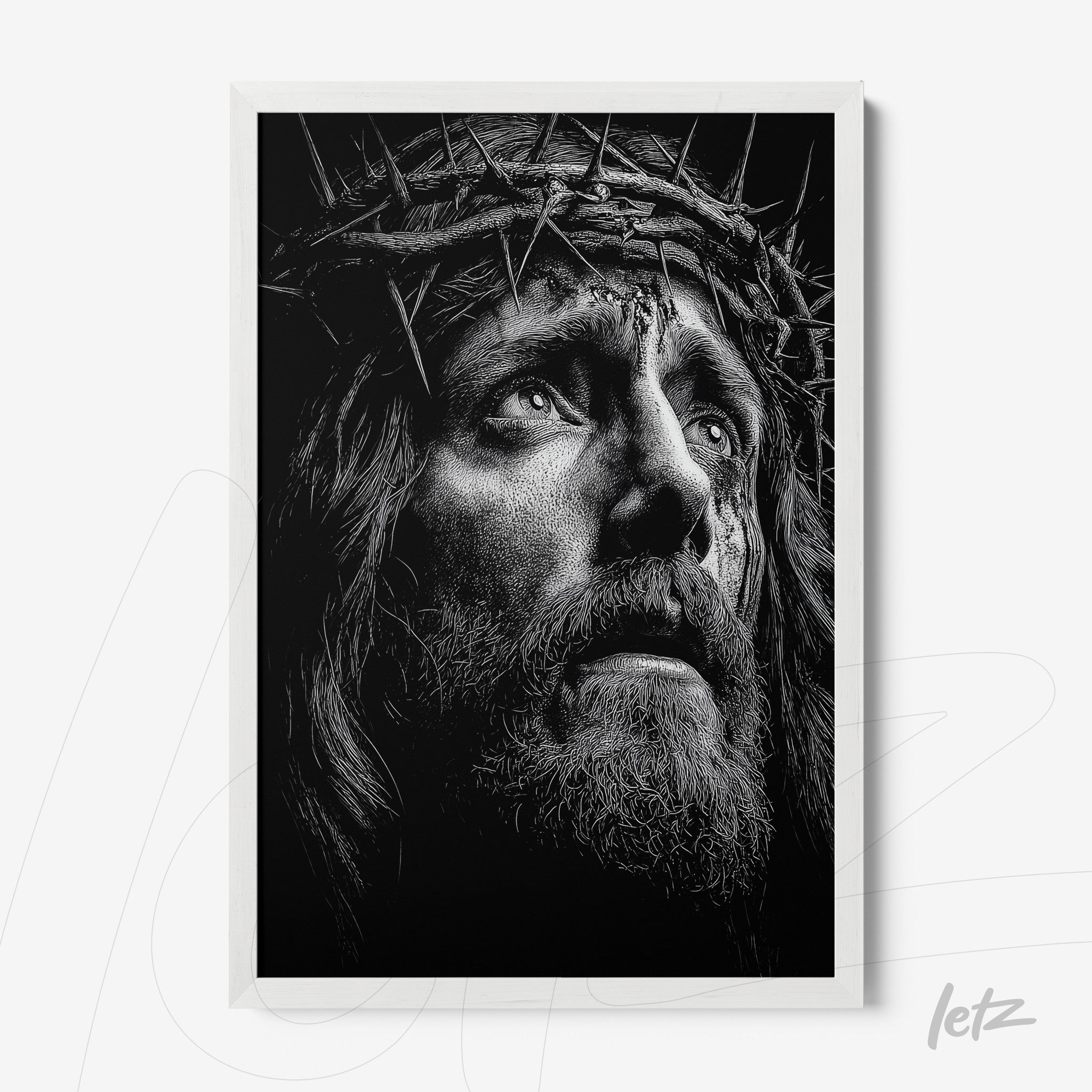 quadro em preto e branco retratando o rosto de Jesus com coroa de espinhos em moldura branca