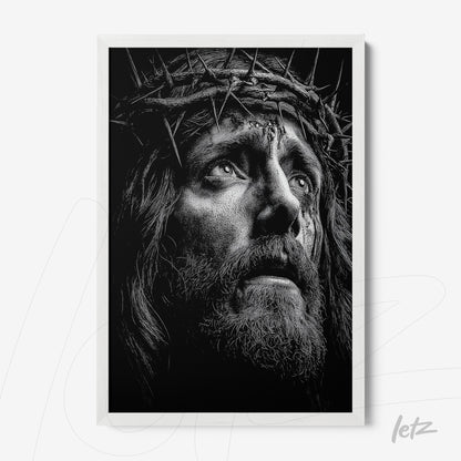 quadro em preto e branco retratando o rosto de Jesus com coroa de espinhos em moldura branca