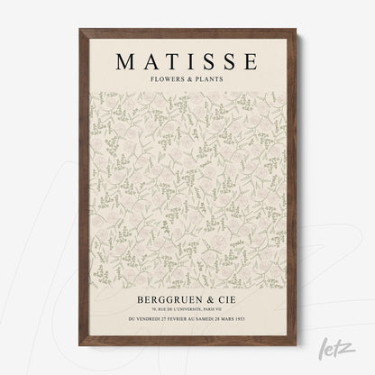 quadro com arte floral em fundo claro com vários elementos verdes, moldura de madeira escura