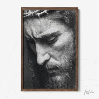 quadro em moldura de madeira escura com retrato em preto e branco de perfil de homem de barba com expressão pensativa