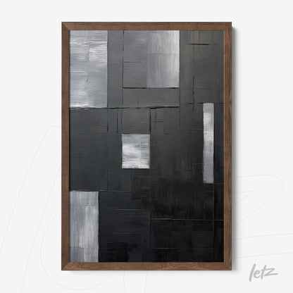 quadro com arte abstrata em tons de preto, cinza e branco, com moldura de madeira escura