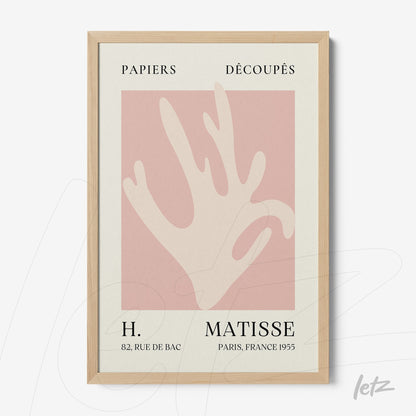 quadro com arte moderna de uma mão estilizada em fundo rosa e moldura clara