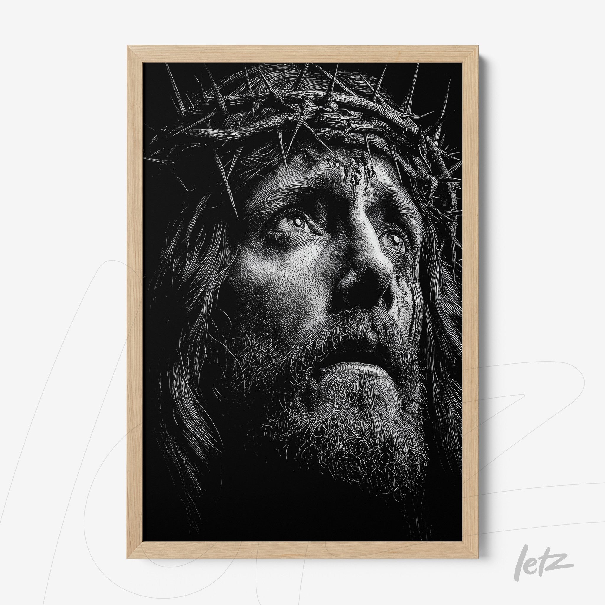 quadro de retrato em preto e branco de figura religiosa com coroa de espinhos em moldura de madeira clara