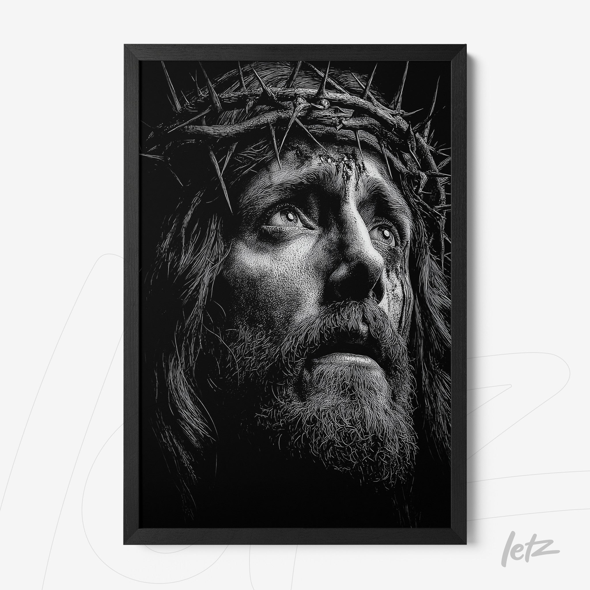 quadro com arte em preto e branco retratando um rosto pensativo de Jesus com coroa de espinhos em moldura preta