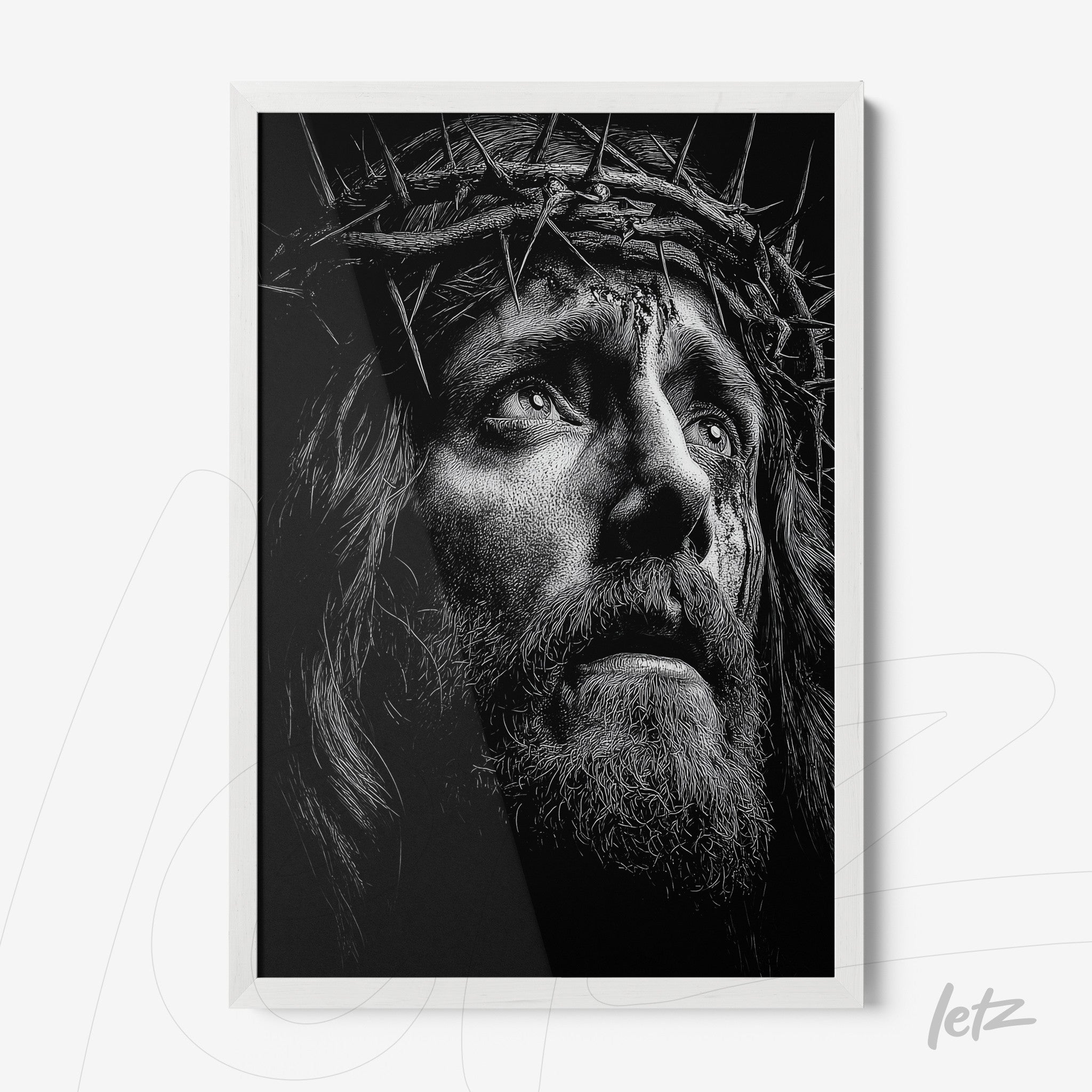 quadro com arte em preto e branco do rosto de Cristo com coroa de espinhos em moldura branca